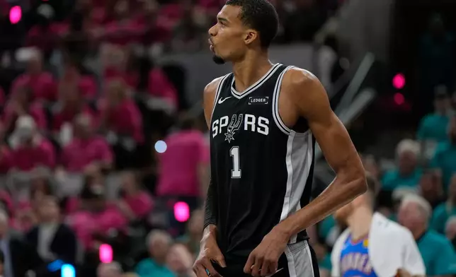 San Antonio Spurs forward Victor Wembanyama (1) reacts during the second half of Game 3 in the Western Conference finals NBA basketball playoffs series against the Oklahoma City Thunder Friday, May 22, 2026, in San Antonio. (AP Photo/Ashley Landis)