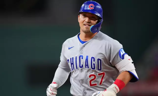 Chicago Cubs' Seiya Suzuki runs the bases after hitting a two-run home run off Texas Rangers starting pitcher Kumar Rocker during the fourth inning of a baseball game Friday, May 8, 2026, in Arlington, Texas. (AP Photo/Julio Cortez)