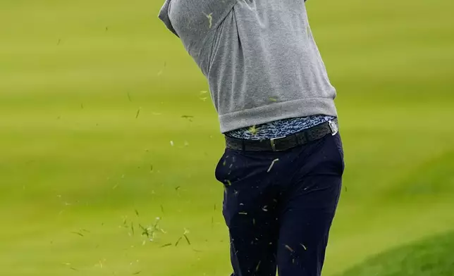 Jon Rahm, of Spain, hits from the rough on the 11th hole during the first round of the PGA Championship golf tournament practice round at Aronimink Golf Club, Thursday, May 14, 2026, in Newtown Square, PA. (AP Photo/Carolyn Kaster)