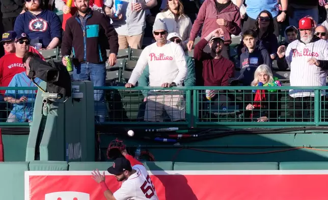 Boston Red Sox right fielder Wilyer Abreu (52) tries but can't make the catch on a solo home run by Philadelphia Phillies designated hitter Kyle Schwarber during the first inning of a baseball game, Tuesday, May 12, 2026, in Boston. (AP Photo/Charles Krupa)