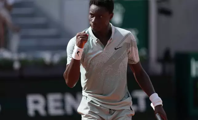 Moise Kouame of France reacts as he plays against Alejandro Tabilo of Chile during their third round men's singles tennis match at the French Open tennis tournament in Paris, Saturday, May 30, 2026. (AP Photo/Thibault Camus)