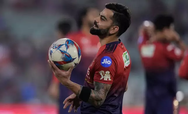 Royal Challengers Bengaluru's Virat Kohli warm ups before the start of the Indian Premier League cricket match between Royal Challengers Bengaluru and Mumbai Indians in Raipur, India, Sunday, May 10, 2026. (AP Photo/Mahesh Kumar A.)