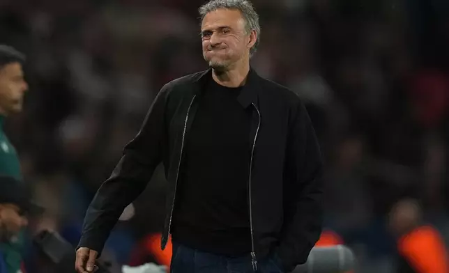 PSG's head coach Luis Enrique grimaces during the Champions League semifinal first leg soccer match between Paris Saint-Germain and Bayern Munich in Paris, Tuesday, April 28, 2026. (AP Photo/Christophe Ena)