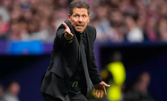 Atletico Madrid's head coach Diego Simeone gestures from the touchline during a Champions League semifinal, first leg, soccer match between Atletico Madrid and Arsenal in Madrid, Spain, Wednesday, April 29, 2026. (AP Photo/Jose Breton)