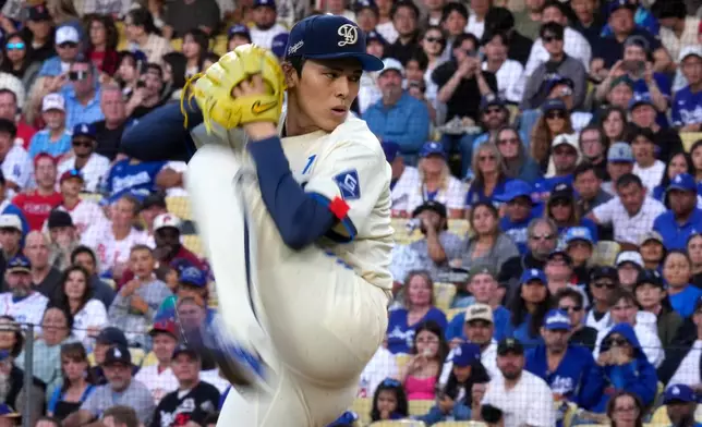 Los Angeles Dodgers starting pitcher Roki Sasaki throws to the plate during the first inning of a baseball game against the Philadelphia Phillies, Saturday, May 30, 2026, in Los Angeles. (AP Photo/Mark J. Terrill)