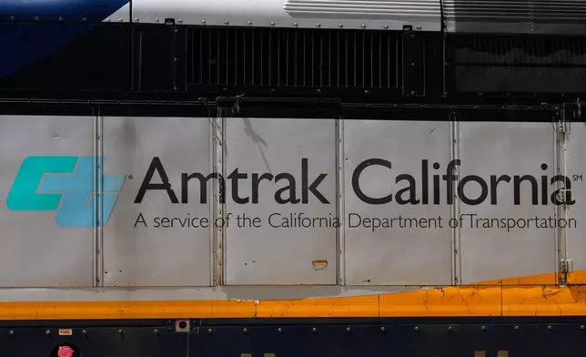 An Amtrak train leaves a station in Emeryville, Calif., Thursday, April 30, 2026. (AP Photo/Jeff Chiu)
