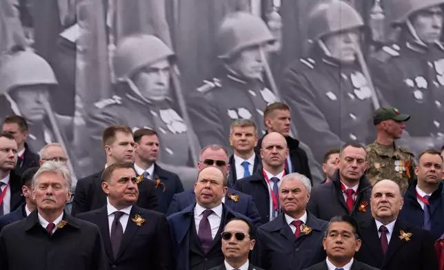 From left, Kremlin spokesman Dmitry Peskov, Russian Presidential Aide Alexei Dyumin, Chief of Staff of the Presidential Executive Office Anton Vaino, Russian State Duma Chairman Vyacheslav Volodin and Russian Prime Minister Mikhail Mishustin attend the Victory Day military parade in Moscow, Saturday, May 9, 2026, during celebrations of the 81st anniversary of the Soviet Union's victory over Nazi Germany during the World War II. (AP Photo/Pavel Bednyakov, Pool)