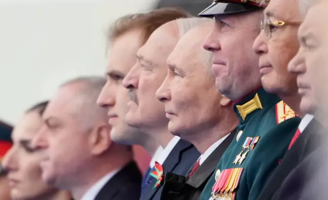 Russian President Vladimir Putin, fourth right, and foreign leaders attend the Victory Day military parade in Moscow, Saturday, May 9, 2026, during celebrations of the 81st anniversary of the Soviet Union's victory over Nazi Germany during the World War II. (AP Photo/Pavel Bednyakov, Pool)
