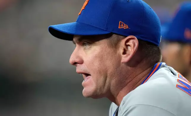New York Mets manager Carlos Mendoza shouts at the home plate umpire during the eighth inning of a baseball game against the Arizona Diamondbacks, Saturday, May 9, 2026, in Phoenix. (AP Photo/Ross D. Franklin)