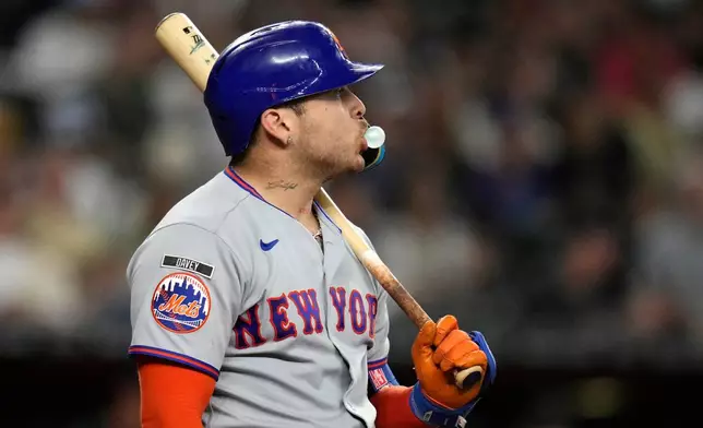 New York Mets' Francisco Alvarez pauses at home plate during the seventh inning of a baseball game against the Arizona Diamondbacks, Saturday, May 9, 2026, in Phoenix. (AP Photo/Ross D. Franklin)