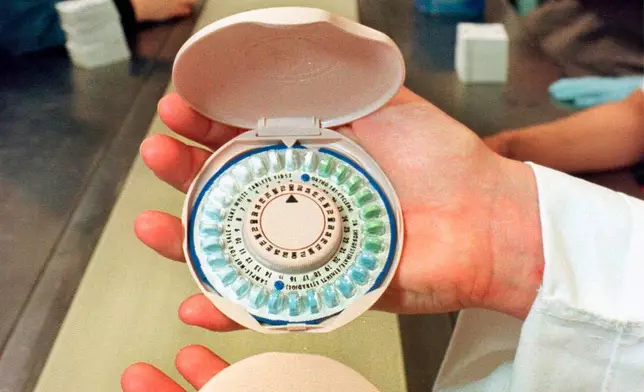 FILE - A birth control pill container is designed to look like a woman's makeup compact for Ortho-McNeil Pharmaceutical Inc., of Raritan, N.J., May 28, 1999. (AP Photo/Mike Derer, File)