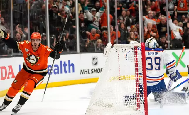 Anaheim Ducks left wing Chris Kreider, left, celebrates his goal on Edmonton Oilers goaltender Connor Ingram, right, during the first period of Game 6 in the first round of the NHL hockey Stanley Cup playoffs series, Thursday, April 30, 2026, in Anaheim, Calif. (AP Photo/Mark J. Terrill)