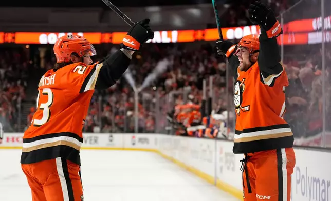 Anaheim Ducks center Ryan Poehling, right, celebrates his goal with center Mason McTavish during the first period of Game 6 in the first round of the NHL hockey Stanley Cup playoffs series against the Edmonton Oilers, Thursday, April 30, 2026, in Anaheim, Calif. (AP Photo/Mark J. Terrill)
