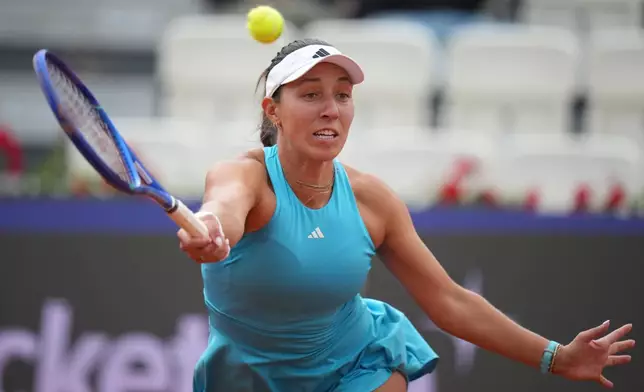 United States' Jessica Pegula returns the ball to Switzerland's Rebeka Masarova, during their match at the Italian Open tennis tournament in Rome, Sunday, May 10, 2026. (AP Photo/Andrew Medichini)