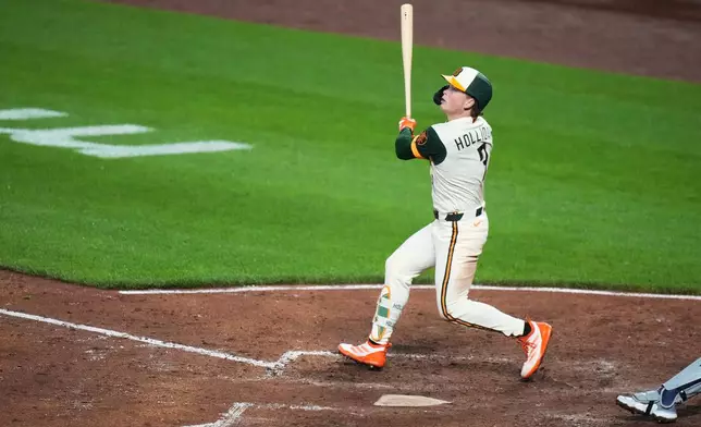 Baltimore Orioles' Jackson Holliday (7) hits a two-run home run during the fourth inning of a baseball game against the Detroit Tigers, Friday, May 22, 2026, in Baltimore. (AP Photo/Stephanie Scarbrough)