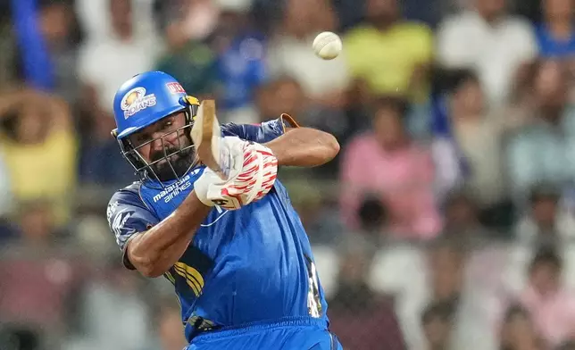Mumbai Indians' Rohit Sharma plays a shot during the Indian Premier League cricket match between Mumbai Indians and Lucknow Super Giants in Mumbai, India, Monday, May 4, 2026.(AP Photo/Rafiq Maqbool)