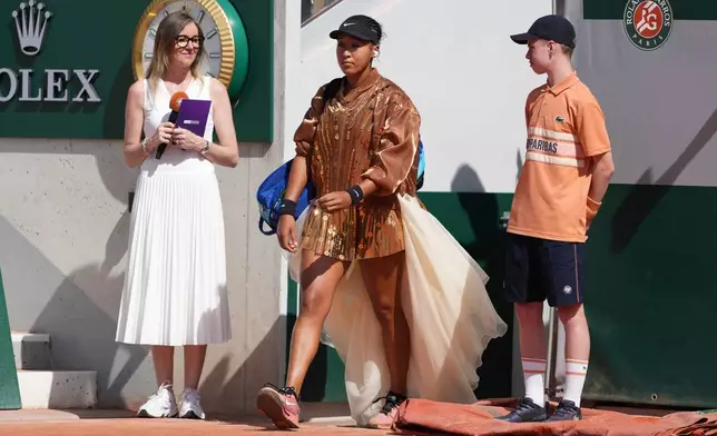Naomi Osaka of Japan enters the court for the second round women's singles tennis match against Donna Vekic of Croatia at the French Open tennis tournament in Paris, Thursday, May 28, 2026. (AP Photo/Thibault Camus)