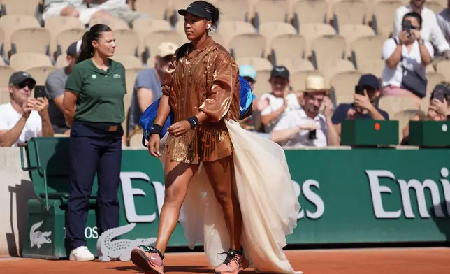 Naomi Osaka of Japan enters the court for the second round women's singles tennis match against Donna Vekic of Croatia at the French Open tennis tournament in Paris, Thursday, May 28, 2026. (AP Photo/Thibault Camus)