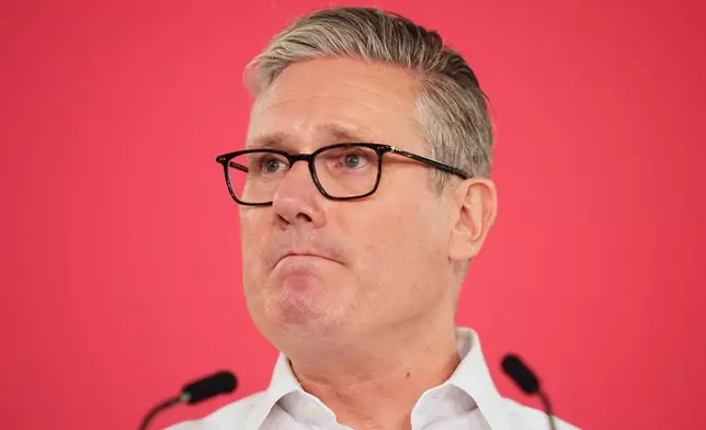 Britain's Prime Minister Sir Keir Starmer pauses as he delivers a speech, at the Coin Street Neighbourhood Centre in Waterloo, London, Monday May 11, 2026. (James Manning/PA via AP)