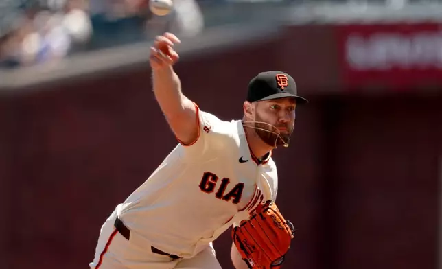 San Francisco Giants pitcher Adrian Houser throws against the San Diego Padres during the first inning of a baseball game in San Francisco, Wednesday, May 6, 2026. (AP Photo/Jed Jacobsohn)