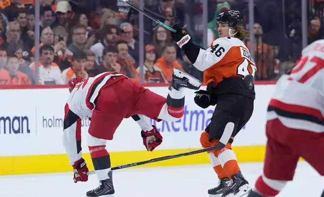Carolina Hurricanes' Sean Walker, left, and Philadelphia Flyers' Trevor Zegras collide during the second period of Game 3 in the second round of the NHL hockey Stanley Cup playoffs, Thursday, May 7, 2026, in Philadelphia. (AP Photo/Matt Slocum)