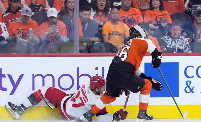 Carolina Hurricanes' Andrei Svechnikov, left, and Philadelphia Flyers' Trevor Zegras collide during the second period of Game 3 in the second round of the NHL hockey Stanley Cup playoffs, Thursday, May 7, 2026, in Philadelphia. (AP Photo/Matt Slocum)