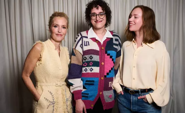 Gillian Anderson, from left, director Jane Schoenbrun, and Hannah Einbinder pose for portrait photographs for the film 'Teenage Sex and Death at Camp Miasma' during the 79th international film festival, Cannes, southern France, Tuesday, May 12, 2026. (Photo by Scott A Garfitt/Invision/AP)