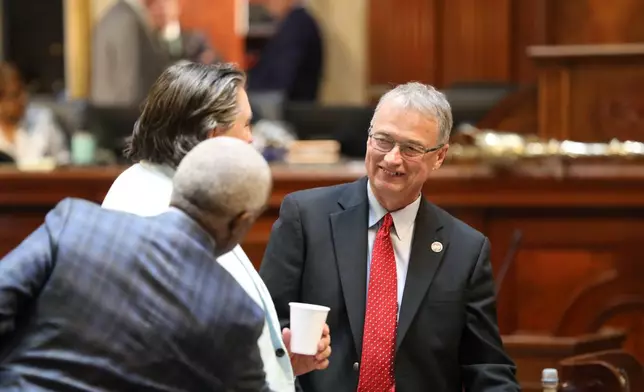 Republican South Carolina House Majority Leader Davey Hiott talks to colleagues on Thursday, May 14, 2026, in Columbia, S.C.. (AP Photo/Jeffrey Collins)