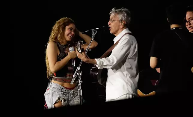 Colombian singer Shakira and Brazilian singer Caetano Veloso take part in a rehearsal a day ahead of Shakira's free concert, on Copacabana beach, in Rio de Janeiro, Friday, May 1, 2026. (AP Photo/Bruna Prado)