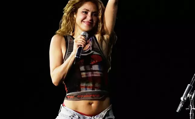 Colombian singer Shakira waves to fans during a rehearsal a day ahead of her free concert on Copacabana beach in Rio de Janeiro, Friday, May 1, 2026. (AP Photo/Bruna Prado)