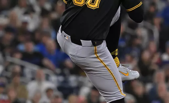 Pittsburgh Pirates pitcher Paul Skenes (30) throws to a Toronto Blue Jays batter during the first inning of a baseball game in Toronto, Saturday, May 23, 2026. (Jon Blacker/The Canadian Press via AP)