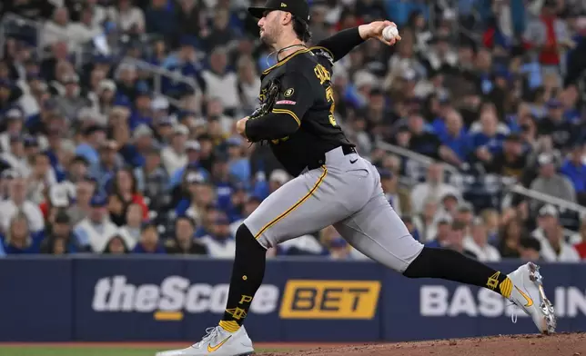 Pittsburgh Pirates pitcher Paul Skenes (30) throws to a Toronto Blue Jays batter during the first inning of a baseball game in Toronto, Saturday, May 23, 2026. (Jon Blacker/The Canadian Press via AP)