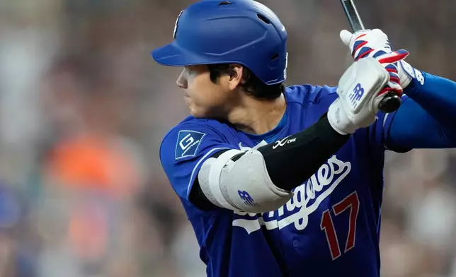 Los Angeles Dodgers designated hitter Shohei Ohtani prepares to bat during the first inning of a baseball game against the Houston Astros in Houston, Monday, May 4, 2026. (AP Photo/Ashley Landis)