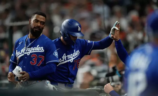 Los Angeles Dodgers' Alex Freeland (76) returns to the dugout after hitting a home run during the second inning of a baseball game against the Houston Astros in Houston, Monday, May 4, 2026. (AP Photo/Ashley Landis)