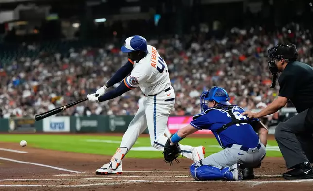 Houston Astros designated hitter Yordan Alvarez (44) singles during the first inning of a baseball game against the Los Angeles Dodgers in Houston, Monday, May 4, 2026. (AP Photo/Ashley Landis)