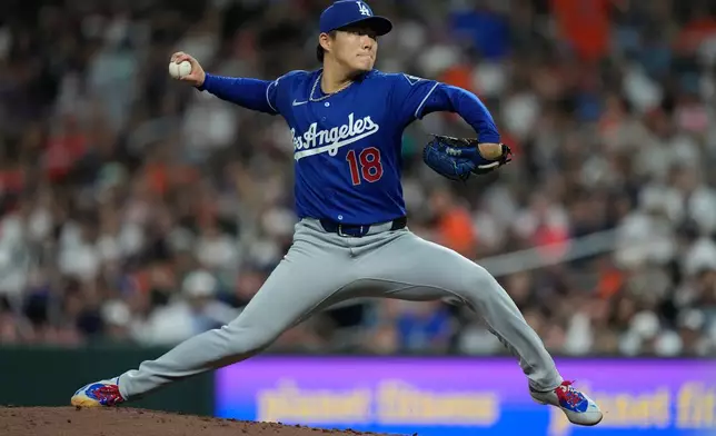 Los Angeles Dodgers starting pitcher Yoshinobu Yamamoto (18) throws during the fourth inning of a baseball game against the Houston Astros in Houston, Monday, May 4, 2026. (AP Photo/Ashley Landis)