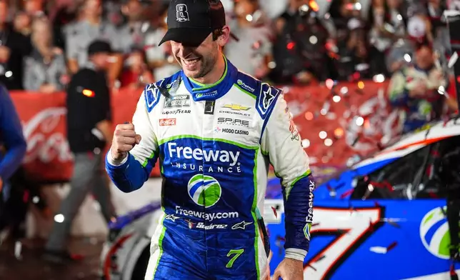 Daniel Suarez celebrates in Victory Lane after winning a NASCAR Cup Series auto race, Sunday, May 24, 2026, in Charlotte, N.C. (AP Photo/Matt Kelley)