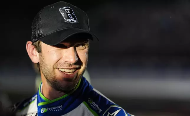 Daniel Suarez smiles after winning a NASCAR Cup Series auto race, Sunday, May 24, 2026, in Charlotte, N.C. (AP Photo/Matt Kelley)