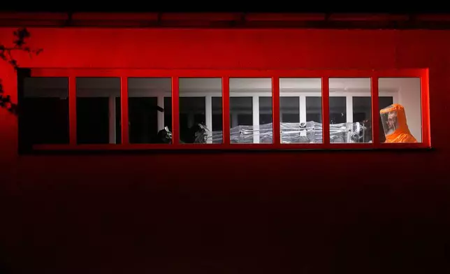 A U.S. doctor, who was in contact with people infected with Ebola in Uganda, arrives in a hospital in Prague, Czech Republic, Thursday, May 21, 2026. (AP Photo/Petr David Josek)