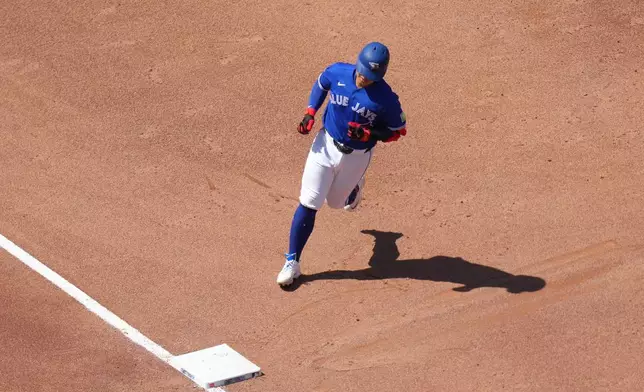 Toronto Blue Jays' Kazuma Okamoto (7) rounds the bases after hitting a solo home run during the sixth inning of a baseball game against the Miami Marlins in Toronto, Wednesday, May 27, 2026. (Chris Young/The Canadian Press via AP)