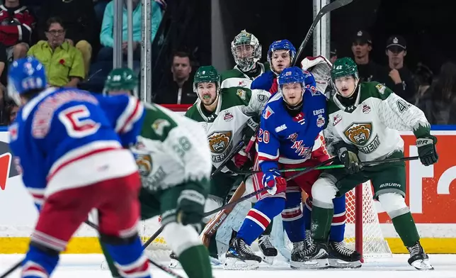 Everett Silvertips' Landon DuPont (9), goalie Anders Miller (31), Brek Liske (42) and Kitchener Rangers' Gabriel Chiarot (20) and Dylan Edwards (16) watch for the shot on goal during the first period of a Memorial Cup hockey game in Kelowna, British Columbia, Monday, May 25, 2026. (Darryl Dyck/The Canadian Press via AP)