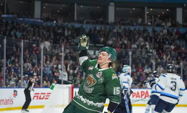 Everett Silvertips' Jaxsin Vaughan (15) celebrates after his goal during the first period of the Memorial Cup semifinal hockey game against the Chicoutimi Sagueneens in Kelowna, British Columbia, Friday, May 29, 2026. (Darryl Dyck/The Canadian Press via AP)