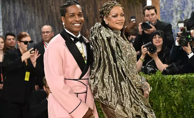 A$AP Rocky, left, and Rihanna arrive at The Metropolitan Museum of Art's Costume Institute benefit gala celebrating the opening of the "Costume Art" exhibition on Monday, May 4, 2026, in New York. (Photo by Evan Agostini/Invision/AP)