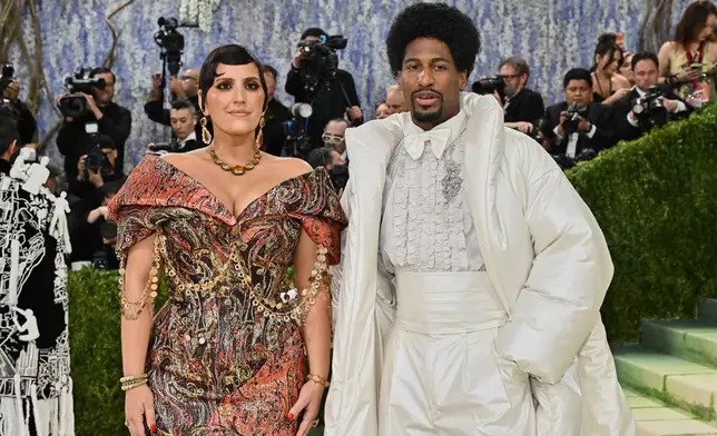 Jon Batiste, left, and Suleika Jaouad arrive at The Metropolitan Museum of Art's Costume Institute benefit gala celebrating the opening of the "Costume Art" exhibition on Monday, May 4, 2026, in New York. (Photo by Evan Agostini/Invision/AP)