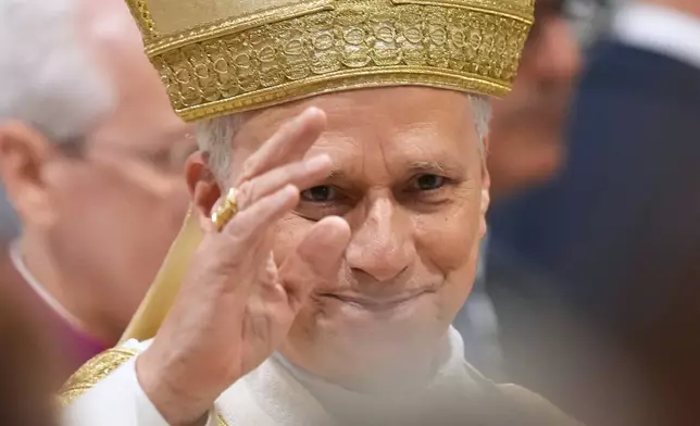 Pope Leo XIV waves after presiding over the ordination of four Auxiliary Bishops of Rome, in Rome's St. John Lateran Basilica, Saturday, May 2, 2026. (AP Photo/Andrew Medichini)