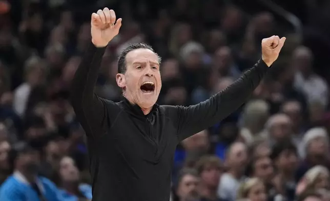 Cleveland Cavaliers head coach Kenny Atkinson shouts in the first half of Game 6 of a second-round NBA basketball playoffs series against the Detroit Pistons Friday, May 15, 2026, in Cleveland. (AP Photo/Sue Ogrocki)