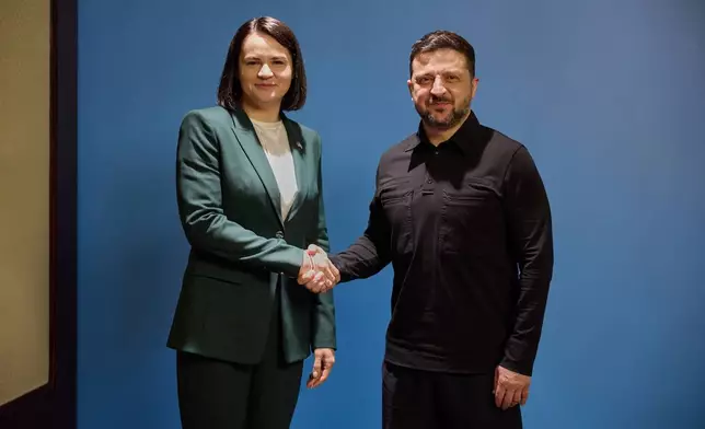 In this photo, provided by the Ukrainian Presidential Press Office, Ukrainian President Volodymyr Zelenskyy, right, shakes hands with Belarusian opposition politician Sviatlana Tsikhanouskaya in Kyiv, Ukraine, Tuesday, May 26, 2026. (Ukrainian Presidential Press Office via AP)