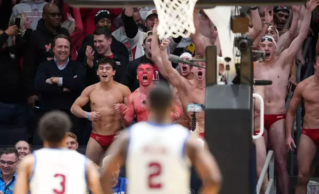 FILE - The Miami (Ohio) swim team attempts to distract SMU forward Corey Washington (3) from taking a free throw during a First Four college basketball game in the NCAA Tournament in Dayton, Ohio, March 18, 2026. (AP Photo/Jeff Dean, File)