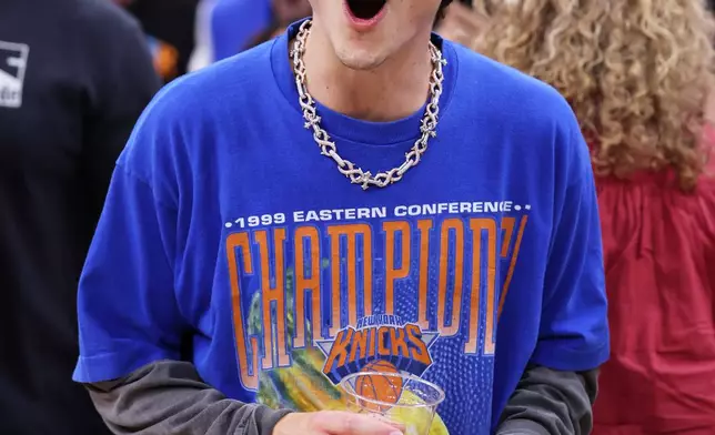 Timothée Chalamet celebrates after Game 4 in the Eastern Conference finals NBA basketball playoffs series between the New York Knicks and the Cleveland Cavaliers in Cleveland, Monday, May 25, 2026. (AP Photo/Tim Phillis)