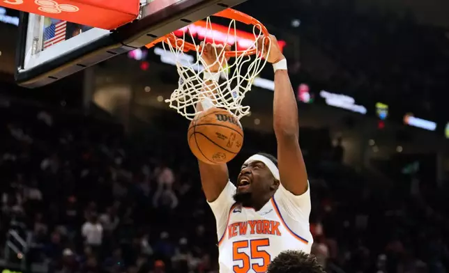 New York Knicks center Ariel Hukporti dunks during the second half of Game 4 in the Eastern Conference finals NBA basketball playoffs series against the Cleveland Cavaliers in Cleveland, Monday, May 25, 2026. (AP Photo/Sue Ogrocki)